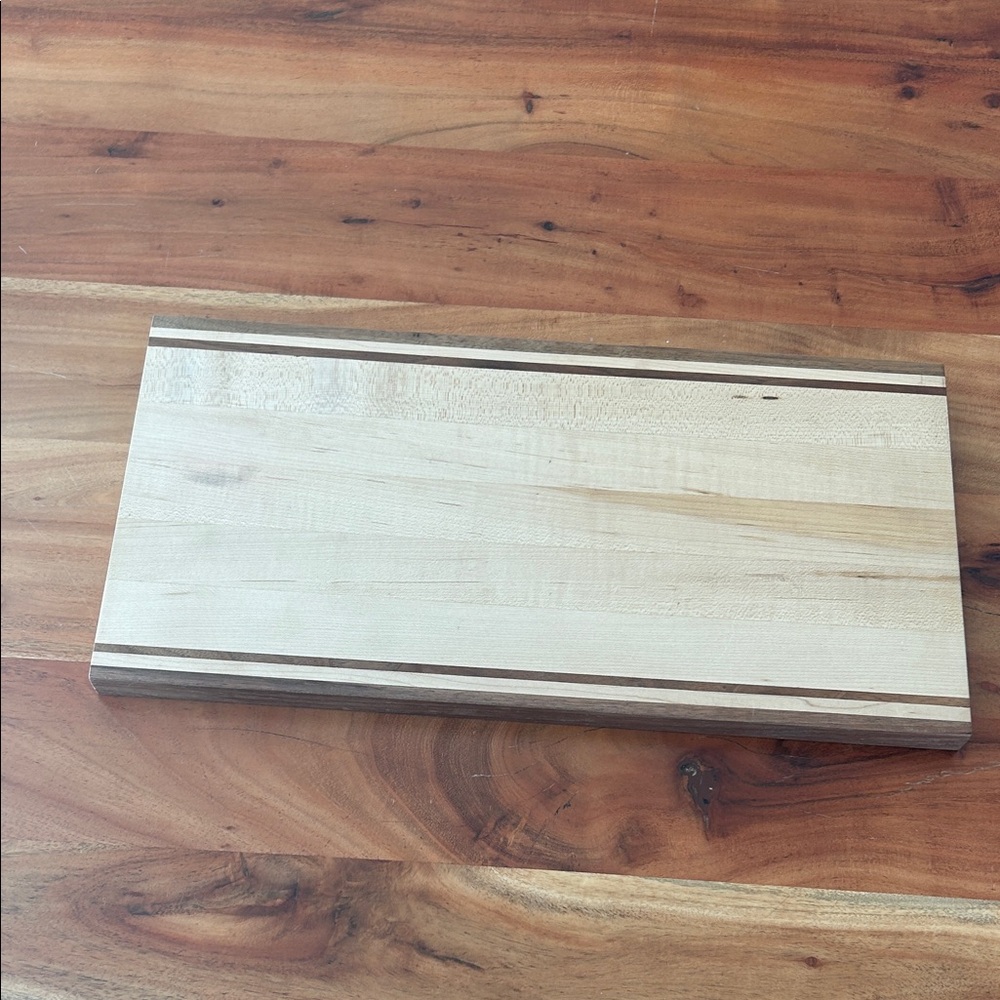 Like new maple and walnut hardwood cutting board 8.5 by 17”